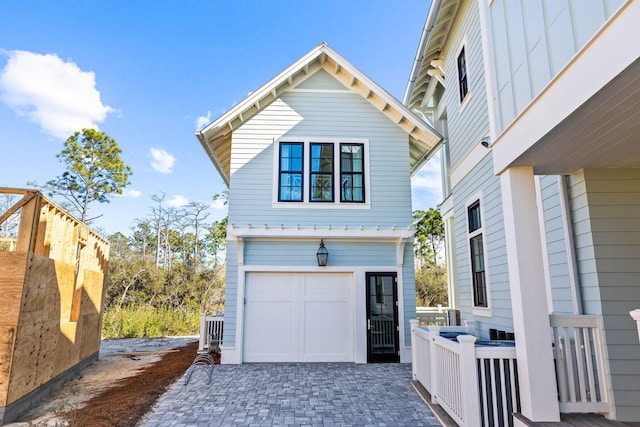 view of side of home with a garage