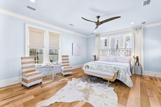 bedroom featuring crown molding, ceiling fan, and light hardwood / wood-style flooring