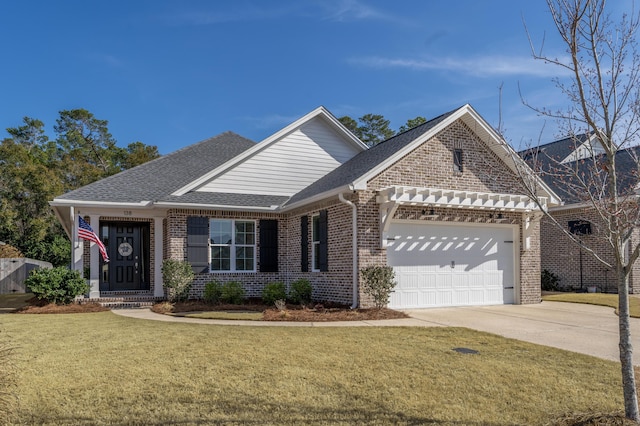 view of front of home featuring brick siding, a shingled roof, a front lawn, concrete driveway, and an attached garage