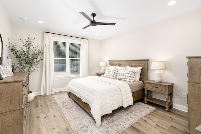 bedroom featuring recessed lighting, light wood-type flooring, and baseboards