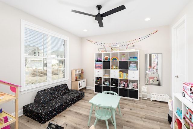 playroom with wood finished floors, recessed lighting, a ceiling fan, and baseboards