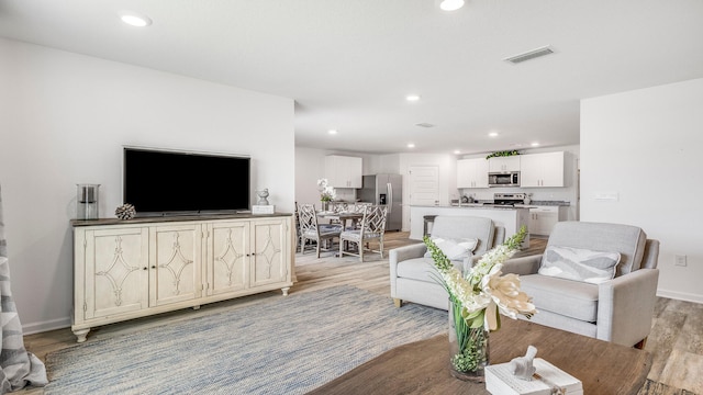 living room featuring light hardwood / wood-style flooring