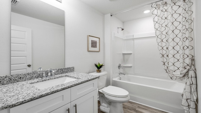 full bathroom featuring shower / bathing tub combination, vanity, wood-type flooring, and toilet