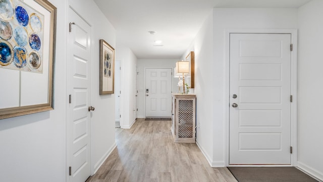 corridor featuring light hardwood / wood-style flooring