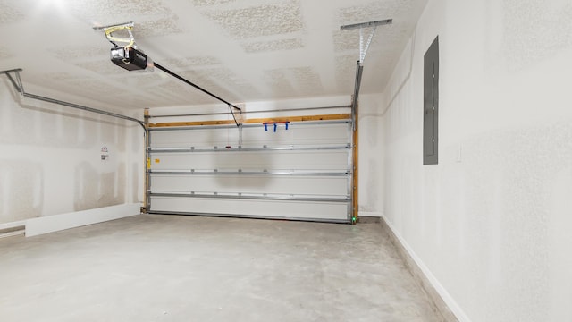 garage with baseboards, electric panel, and a garage door opener