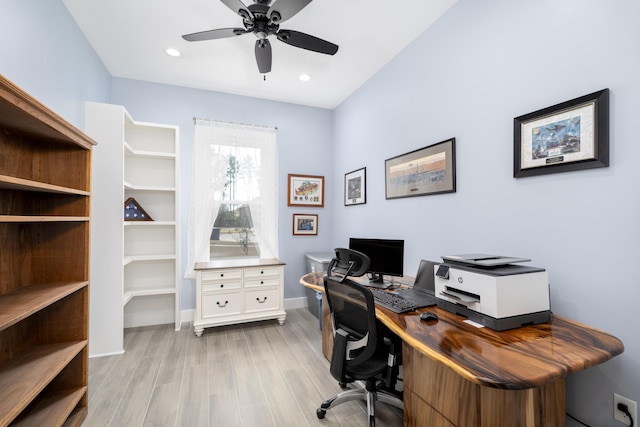 office with ceiling fan and light wood-type flooring