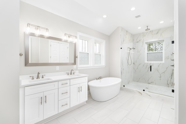 bathroom featuring vanity and separate shower and tub