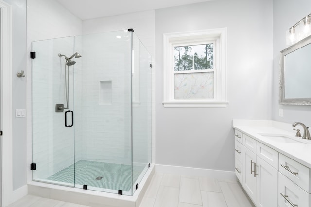 bathroom featuring vanity and walk in shower