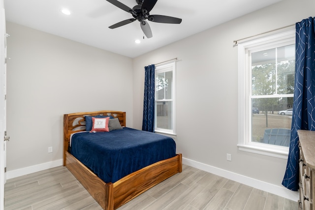 bedroom featuring ceiling fan and light hardwood / wood-style flooring