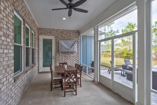 sunroom featuring a wealth of natural light and ceiling fan