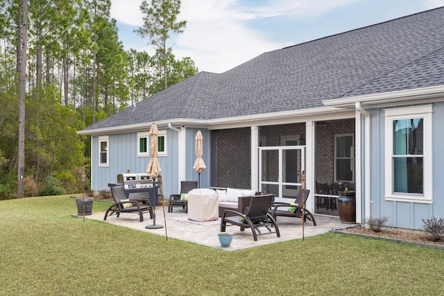 back of house featuring a yard, outdoor lounge area, and a patio