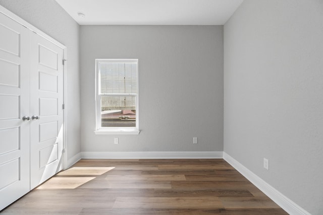 unfurnished bedroom with hardwood / wood-style floors