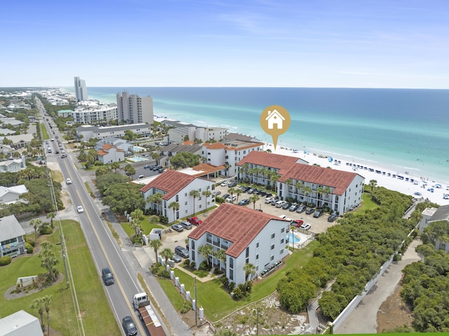 bird's eye view featuring a water view and a view of the beach