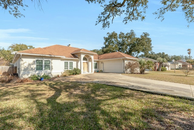 view of front facade featuring a garage and a front lawn