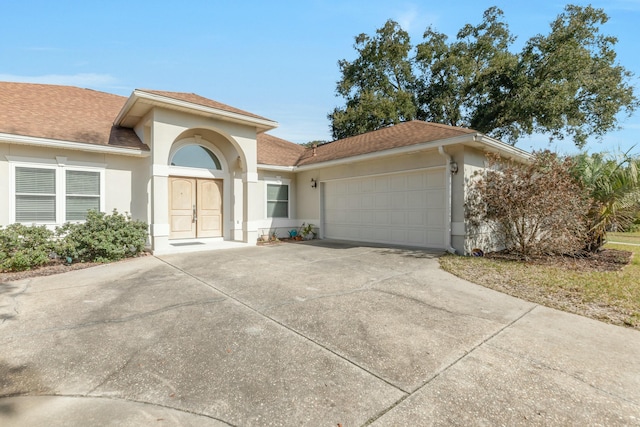 view of front of home with a garage