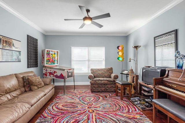 living room featuring ceiling fan, ornamental molding, and hardwood / wood-style floors