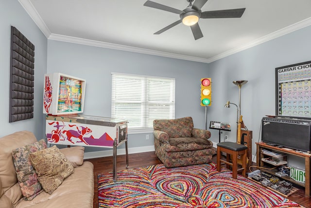 living room with hardwood / wood-style flooring, crown molding, and ceiling fan