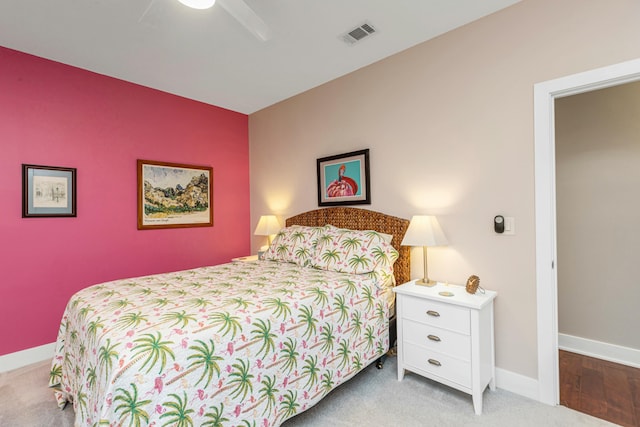 bedroom featuring ceiling fan and carpet