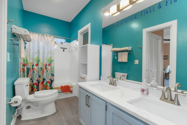 full bathroom featuring vanity, toilet, and shower / bath combo with shower curtain