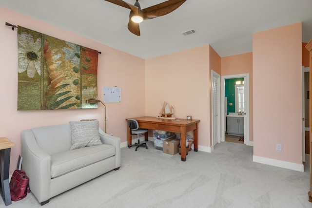 sitting room with light carpet and ceiling fan