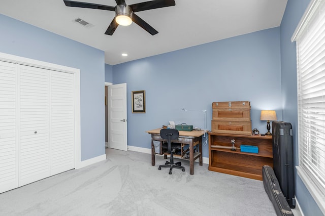 office area featuring ceiling fan and light carpet