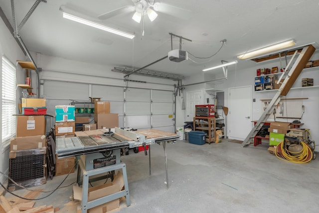 garage with a garage door opener and ceiling fan