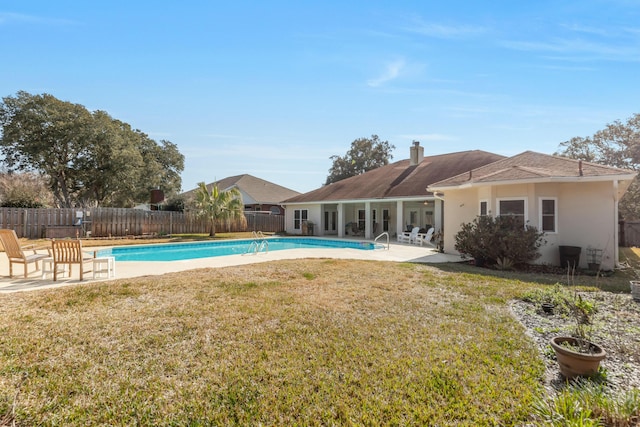 view of pool with a yard and a patio area