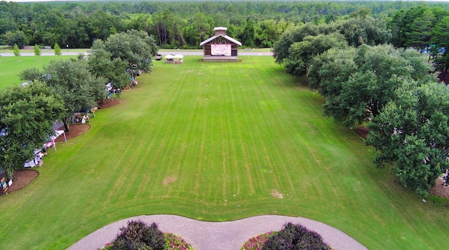 birds eye view of property with a wooded view