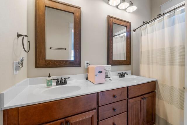 bathroom featuring vanity and walk in shower