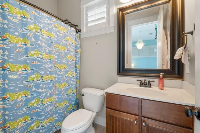 bathroom featuring vanity and toilet