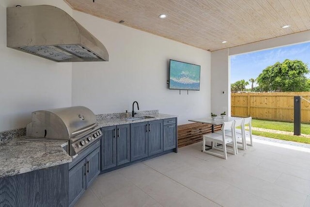 view of patio / terrace featuring sink, a grill, and an outdoor kitchen