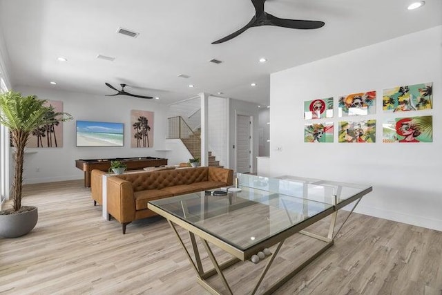 dining area featuring ceiling fan and light wood-type flooring