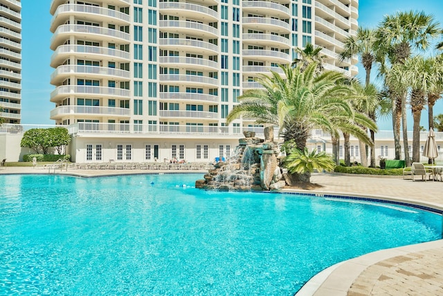 community pool featuring french doors