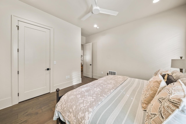 bedroom featuring ceiling fan and dark hardwood / wood-style floors