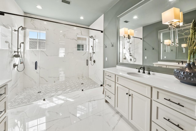 bathroom featuring vanity and an enclosed shower