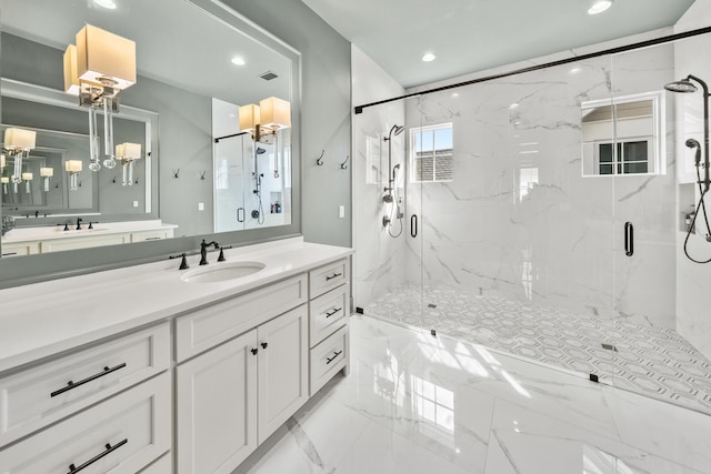 bathroom with vanity and an enclosed shower