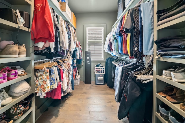 walk in closet featuring light hardwood / wood-style floors