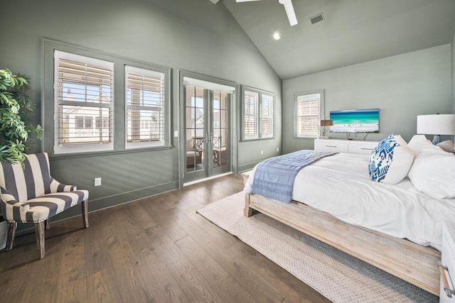 bedroom featuring high vaulted ceiling, access to outside, dark hardwood / wood-style flooring, and french doors