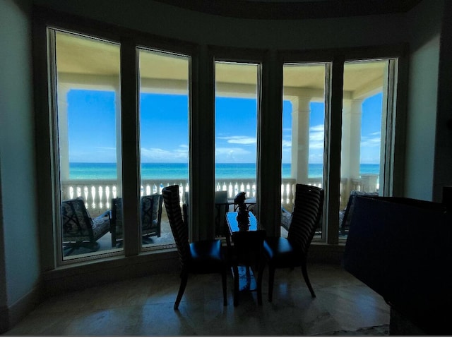 dining room featuring a water view