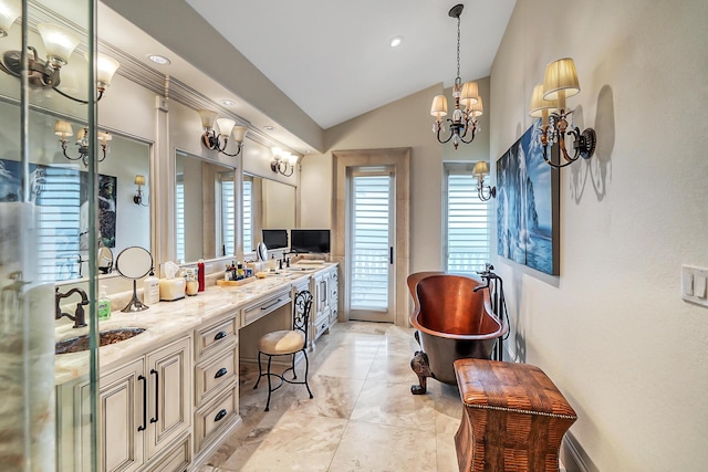 bathroom featuring vaulted ceiling, vanity, and a tub to relax in