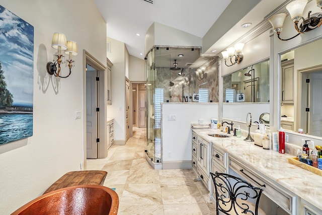 bathroom featuring vaulted ceiling, vanity, and a shower with door