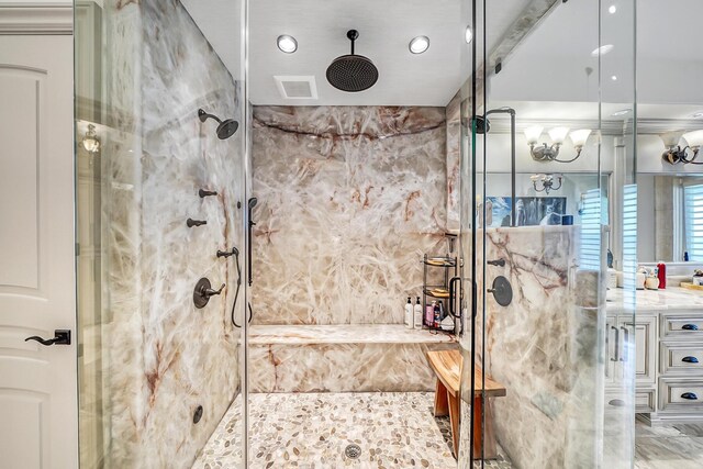 bathroom with vanity and an enclosed shower