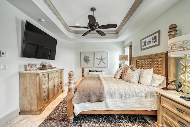 bedroom with crown molding, a raised ceiling, and ceiling fan