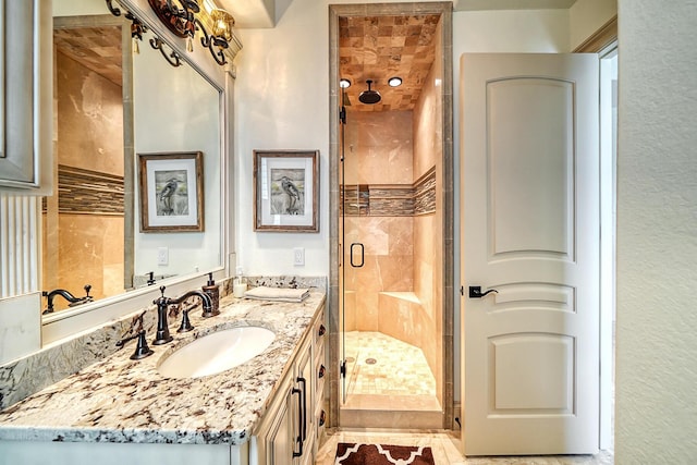 bathroom with vanity and walk in shower