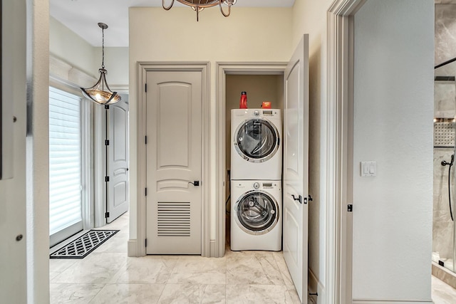 laundry room with stacked washer and clothes dryer