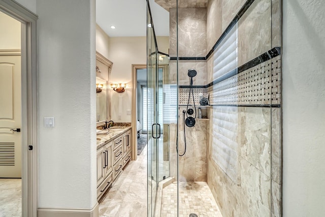 bathroom featuring walk in shower and vanity