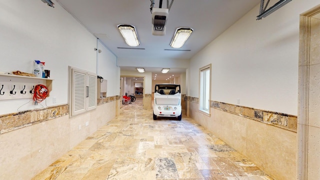 hallway with tile walls