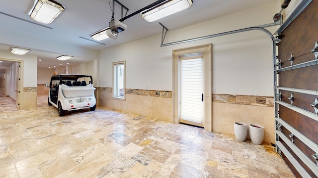 garage featuring a garage door opener