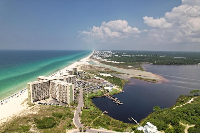 birds eye view of property featuring a water view and a view of the beach