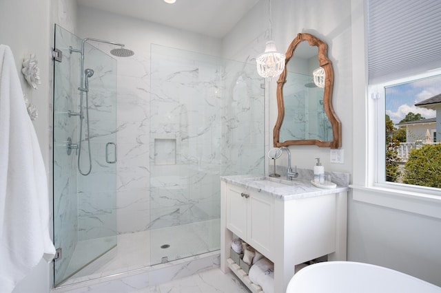 full bath with vanity, marble finish floor, and a marble finish shower